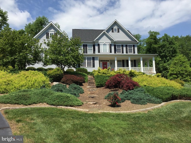 21785 Watson Rd, Leesburg, VA 20175 - colonial-style house featuring covered porch and a front yard