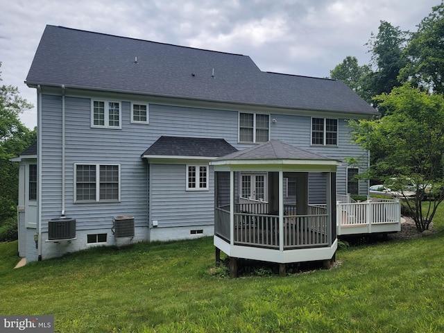 21785 Watson Rd, Leesburg, VA 20175 - back of property with a wooden deck, a yard, a shingled roof, and central AC
