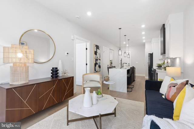 1208 M St NW Unit 52, Washington, DC 20005 - living area with light wood-style flooring, recessed lighting, and baseboards