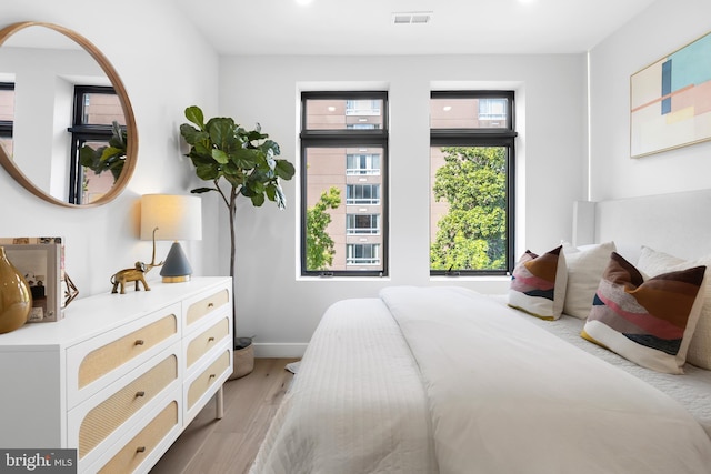 1208 M St NW Unit 52, Washington, DC 20005 - bedroom with light wood-style flooring and baseboards