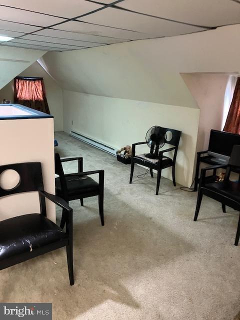 1214 Haworth St, Philadelphia, PA 19124 - sitting room with a baseboard radiator, carpet, and lofted ceiling