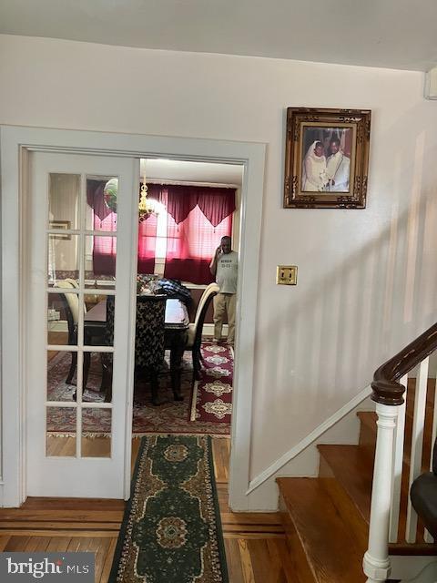 1214 Haworth St, Philadelphia, PA 19124 - entryway featuring stairs, wood finished floors, and baseboards