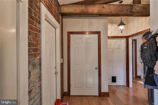 517 W Burke St, Easton, PA 18042 - foyer entrance featuring wood finished floors and brick wall