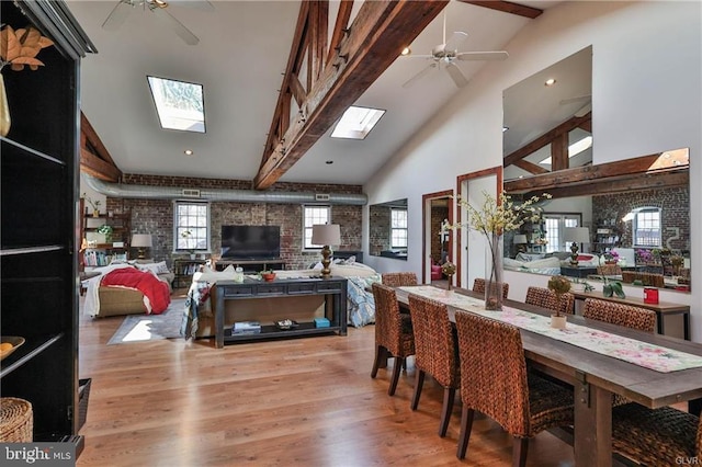 517 W Burke St, Easton, PA 18042 - dining space with ceiling fan, a skylight, light wood-type flooring, beam ceiling, and high vaulted ceiling