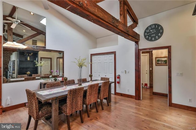 517 W Burke St, Easton, PA 18042 - dining area with high vaulted ceiling, baseboards, wood finished floors, a ceiling fan, and beam ceiling