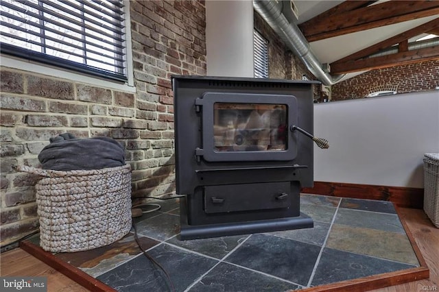 517 W Burke St, Easton, PA 18042 - detailed view of a wood stove, brick wall, and baseboards