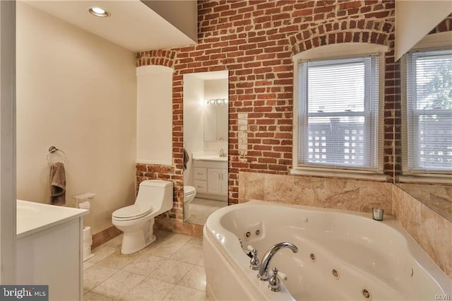 517 W Burke St, Easton, PA 18042 - bathroom featuring toilet, vanity, a tub with jets, and plenty of natural light