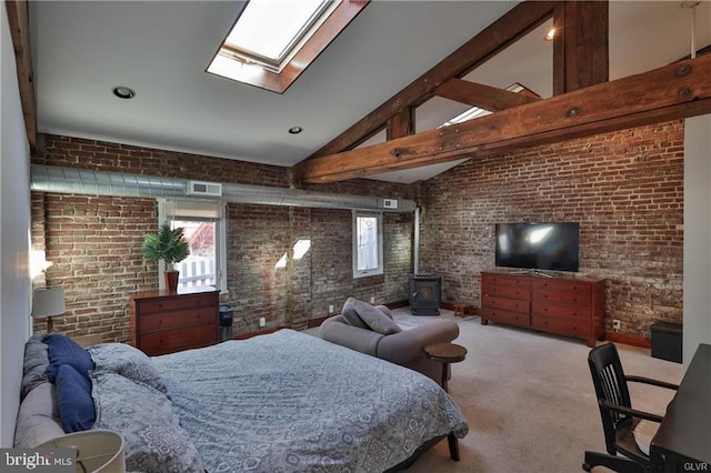 517 W Burke St, Easton, PA 18042 - carpeted bedroom with brick wall, a wood stove, a skylight, beamed ceiling, and high vaulted ceiling