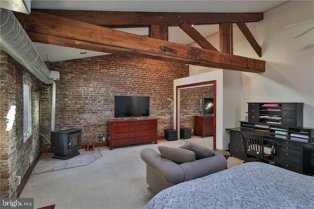 517 W Burke St, Easton, PA 18042 - carpeted bedroom with brick wall, a wood stove, beamed ceiling, and high vaulted ceiling