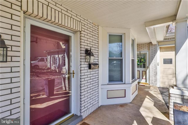 517 W Burke St, Easton, PA 18042 - doorway to property featuring brick siding and a porch