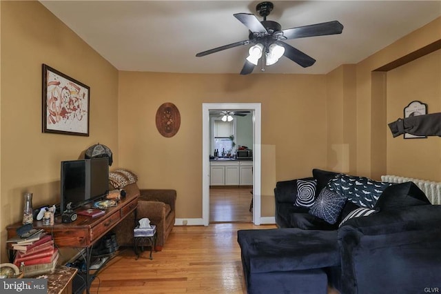 517 W Burke St, Easton, PA 18042 - living area with wood finished floors, a ceiling fan, and baseboards
