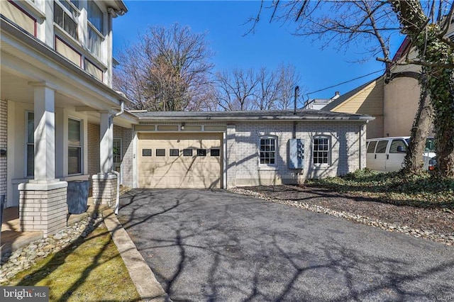 517 W Burke St, Easton, PA 18042 - view of front of home with an attached garage, brick siding, and driveway