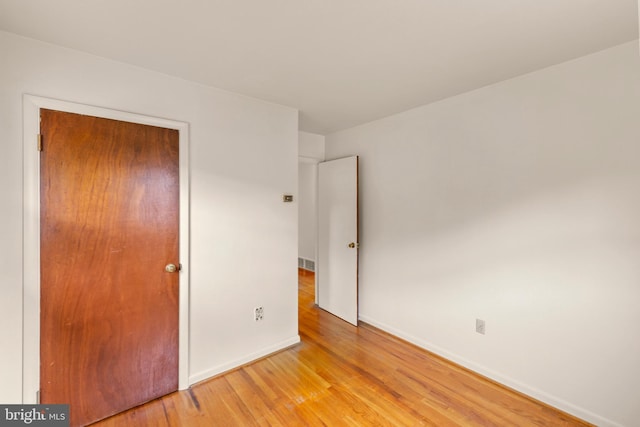 311 S Buckmarsh St, Berryville, VA 22611 - unfurnished bedroom featuring light wood finished floors, baseboards, and a closet