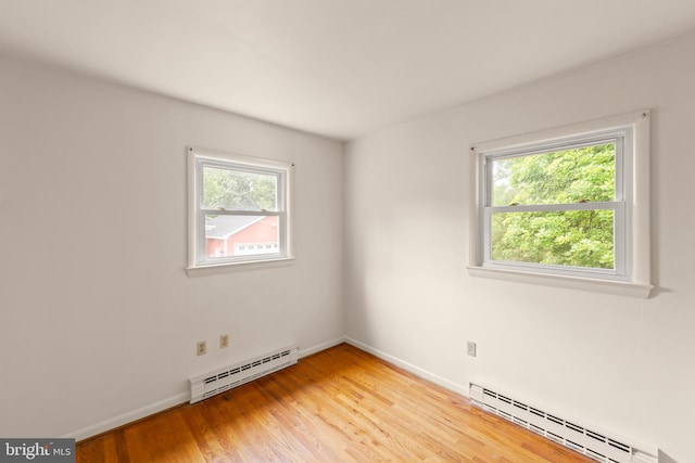 311 S Buckmarsh St, Berryville, VA 22611 - empty room featuring baseboard heating, light wood-style floors, and baseboards