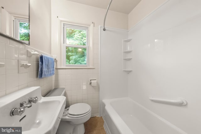 311 S Buckmarsh St, Berryville, VA 22611 - full bath featuring a sink, tile patterned flooring, tile walls, toilet, and shower / tub combination
