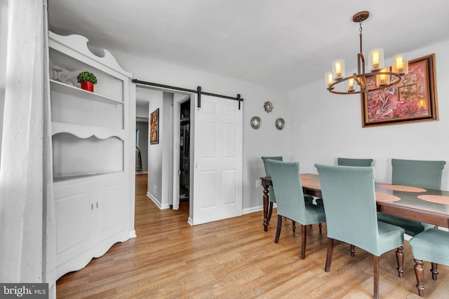 113 Tremont St, Manassas Park, VA 20111 - dining space featuring a chandelier, a barn door, and light wood-type flooring