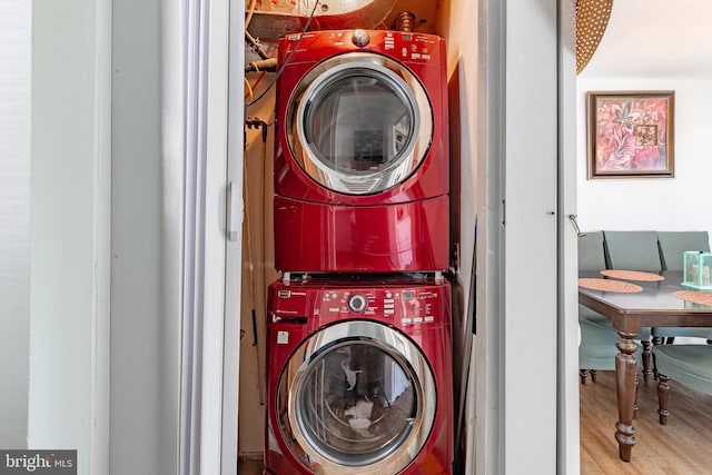 113 Tremont St, Manassas Park, VA 20111 - laundry room featuring stacked washer / drying machine and wood finished floors