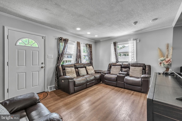 113 Tremont St, Manassas Park, VA 20111 - living room featuring a textured ceiling, crown molding, wood finished floors, plenty of natural light, and recessed lighting