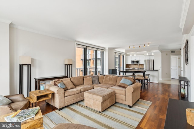 616 E St NW Unit 1114, Washington, DC 20004 - living room with ornamental molding, dark wood finished floors, and baseboards