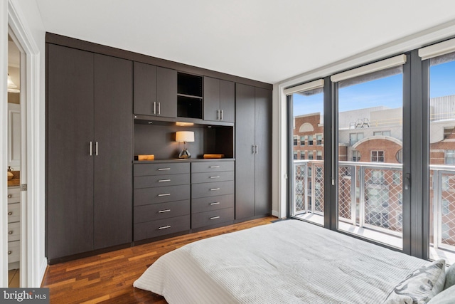 616 E St NW Unit 1114, Washington, DC 20004 - bedroom with dark wood-type flooring