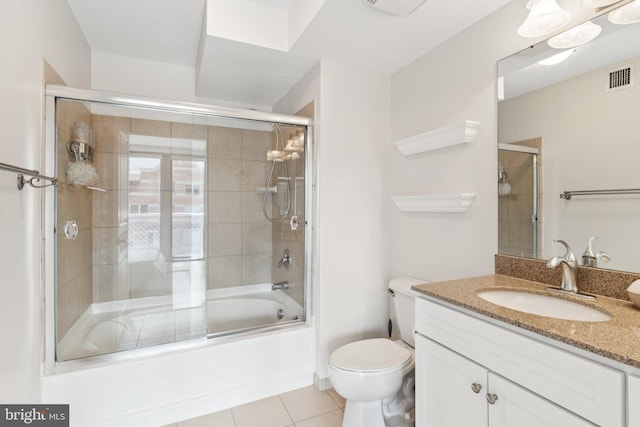 616 E St NW Unit 1114, Washington, DC 20004 - bathroom with toilet, vanity, combined bath / shower with glass door, and tile patterned flooring