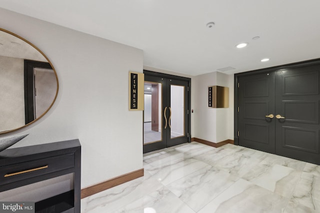 616 E St NW Unit 1114, Washington, DC 20004 - foyer entrance featuring french doors, baseboards, light marble finish floors, and recessed lighting