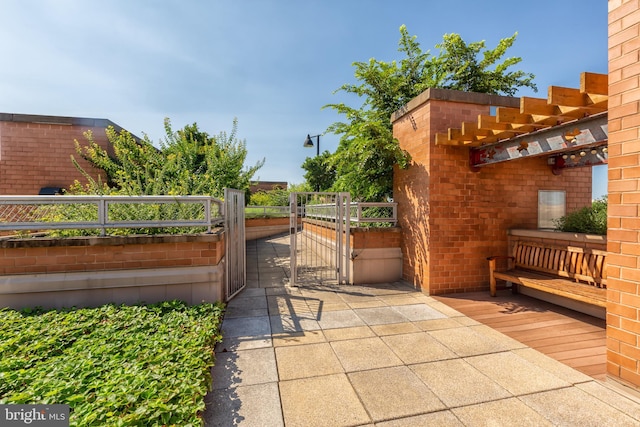 616 E St NW Unit 1114, Washington, DC 20004 - view of patio featuring a gate