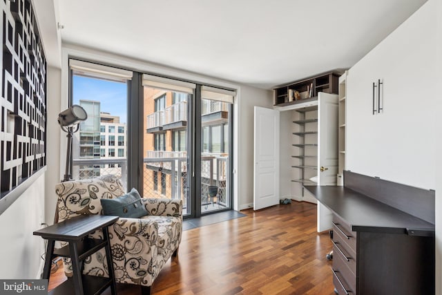 616 E St NW Unit 1114, Washington, DC 20004 - sitting room with dark wood-style floors and baseboards