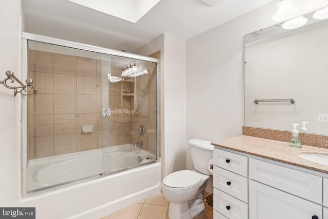 616 E St NW Unit 1114, Washington, DC 20004 - bathroom with vanity, combined bath / shower with glass door, toilet, and tile patterned floors