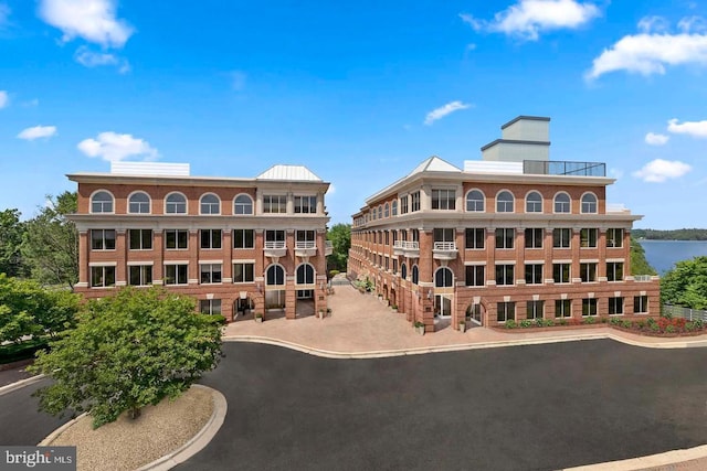 625 Slaters Ln Unit 201, Alexandria, VA 22314 - view of building exterior featuring a water view