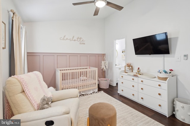 603 Lindsley Ct, Burlington, NJ 08016 - bedroom featuring lofted ceiling, dark wood-type flooring, a crib, a wainscoted wall, and ceiling fan
