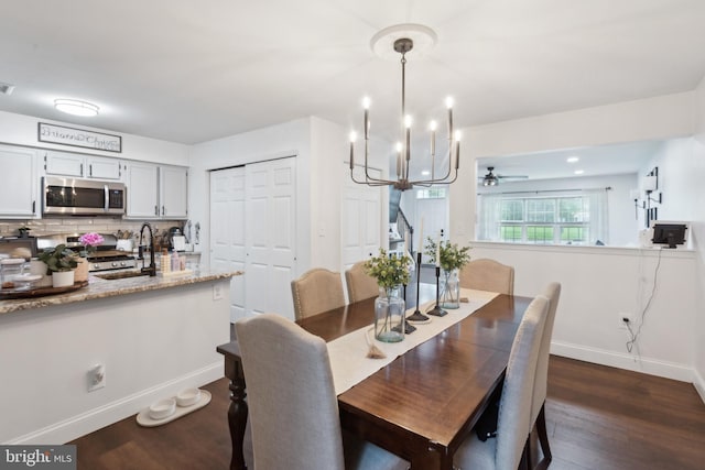603 Lindsley Ct, Burlington, NJ 08016 - dining space with dark wood-type flooring, baseboards, a chandelier, and a ceiling fan