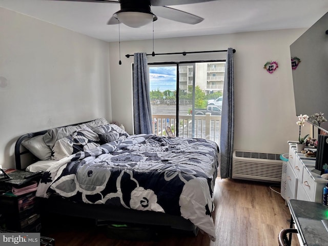 11 62nd St Unit 212, Ocean City, MD 21842 - bedroom with light wood finished floors, access to exterior, and ceiling fan