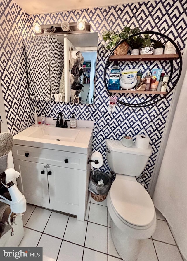11 62nd St Unit 212, Ocean City, MD 21842 - bathroom with wallpapered walls, vanity, tile patterned floors, and toilet