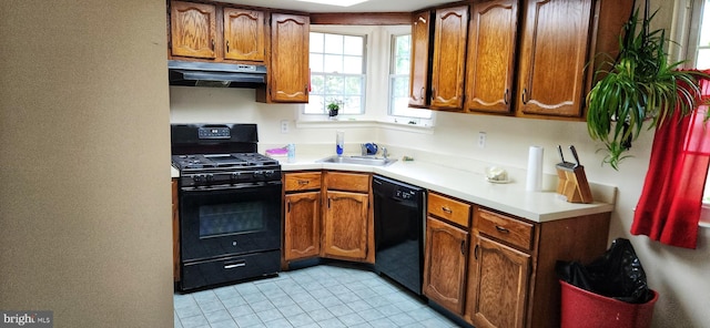20 Norwick Dr, Forked River, NJ 08731 - kitchen featuring black appliances, under cabinet range hood, light countertops, and brown cabinets