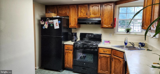20 Norwick Dr, Forked River, NJ 08731 - kitchen with under cabinet range hood, black appliances, a sink, light countertops, and brown cabinetry