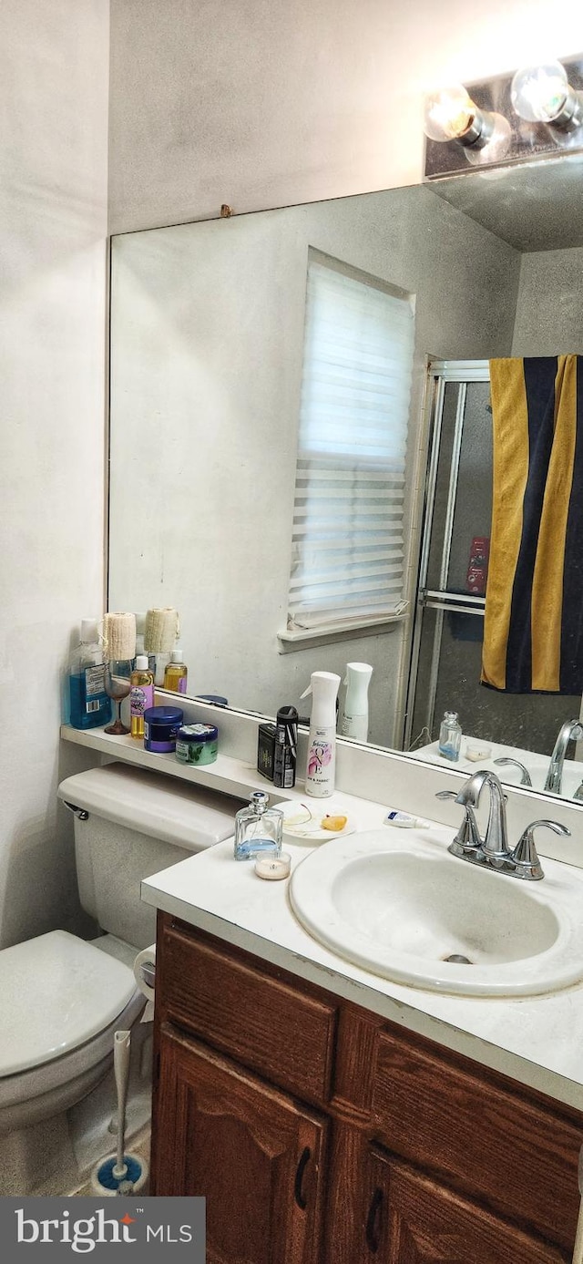 20 Norwick Dr, Forked River, NJ 08731 - bathroom featuring toilet, a stall shower, and vanity