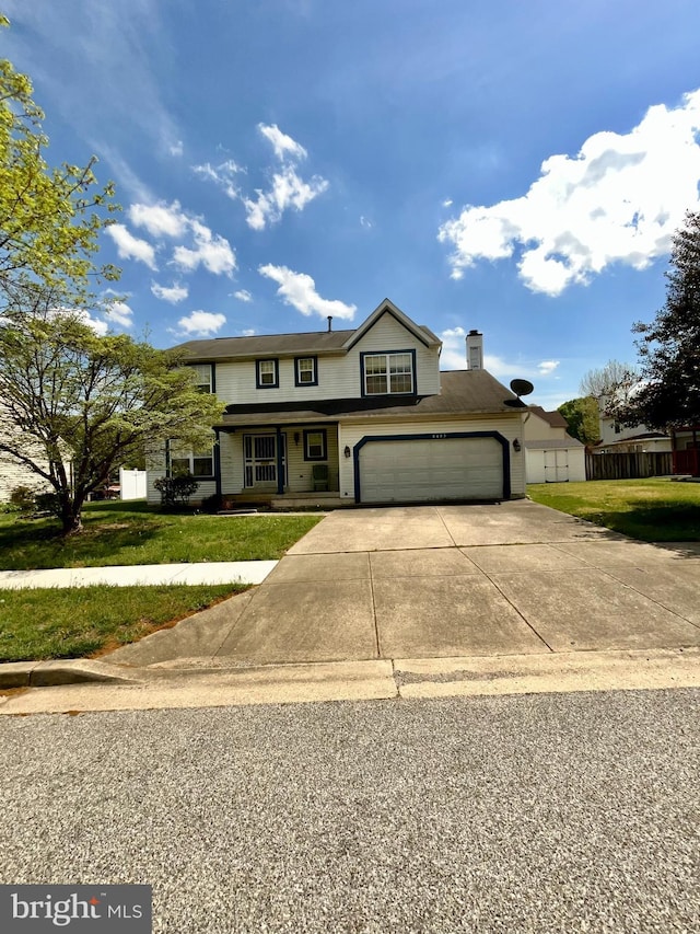 8403 Branchwood Cir, Clinton, MD 20735 - traditional home with concrete driveway, a chimney, a garage, and a porch