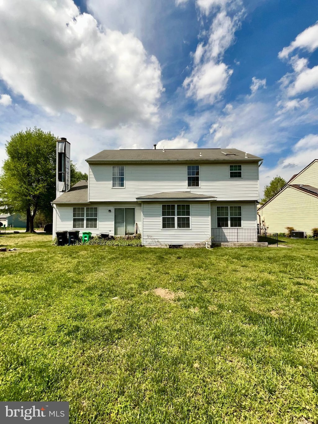 8403 Branchwood Cir, Clinton, MD 20735 - back of property with a lawn and a chimney