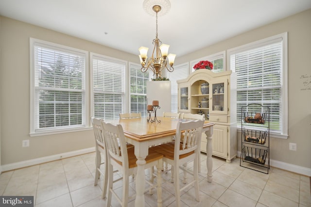 14201 Village Manor Ct, Upper Marlboro, MD 20774 - dining space with baseboards, a chandelier, light tile patterned flooring, and healthy amount of natural light