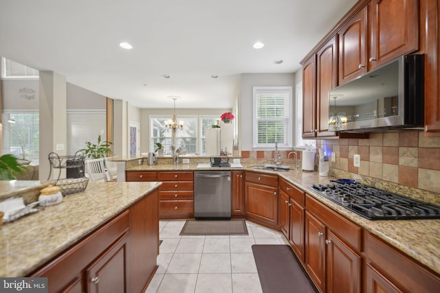 14201 Village Manor Ct, Upper Marlboro, MD 20774 - kitchen with stainless steel appliances, a sink, a chandelier, light stone counters, and light tile patterned floors