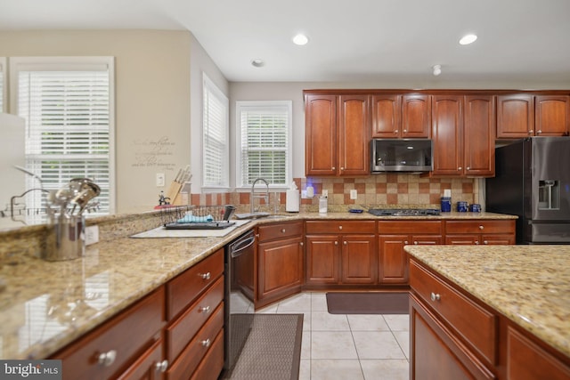 14201 Village Manor Ct, Upper Marlboro, MD 20774 - kitchen featuring black appliances, a sink, light stone counters, light tile patterned floors, and recessed lighting