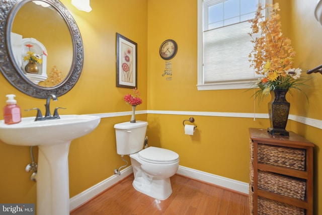 14201 Village Manor Ct, Upper Marlboro, MD 20774 - bathroom featuring toilet, baseboards, and wood finished floors