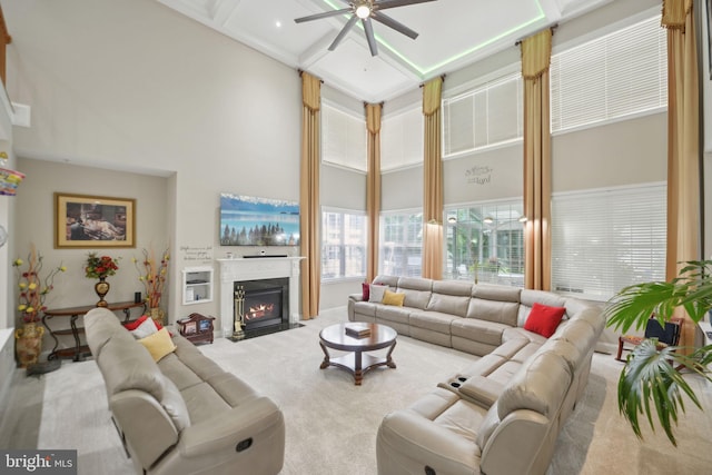 14201 Village Manor Ct, Upper Marlboro, MD 20774 - living area featuring a towering ceiling, carpet flooring, ceiling fan, a fireplace with flush hearth, and coffered ceiling
