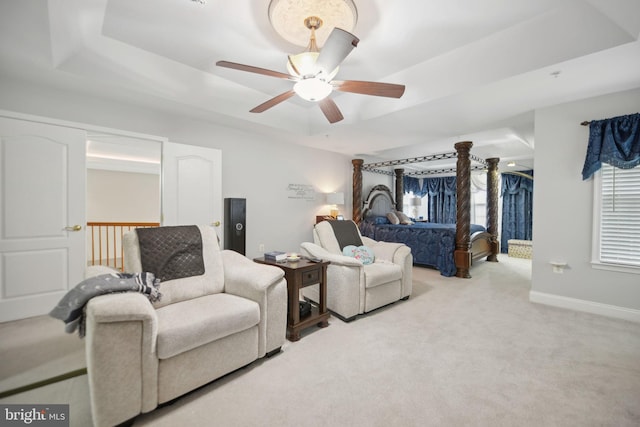14201 Village Manor Ct, Upper Marlboro, MD 20774 - bedroom with a raised ceiling, light carpet, baseboards, and ceiling fan