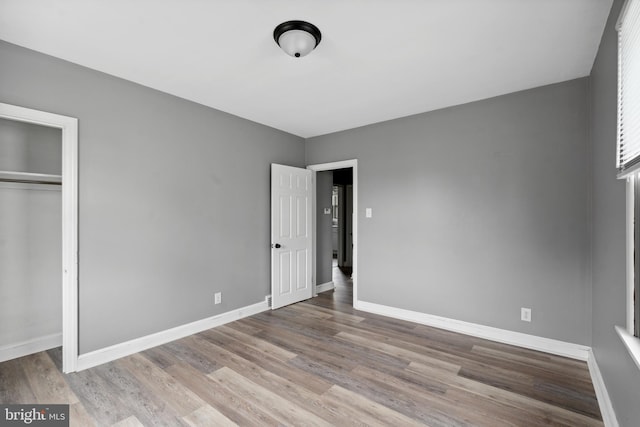 218 Center Ave, Mount Ephraim, NJ 08059 - unfurnished bedroom featuring wood finished floors, baseboards, and a closet