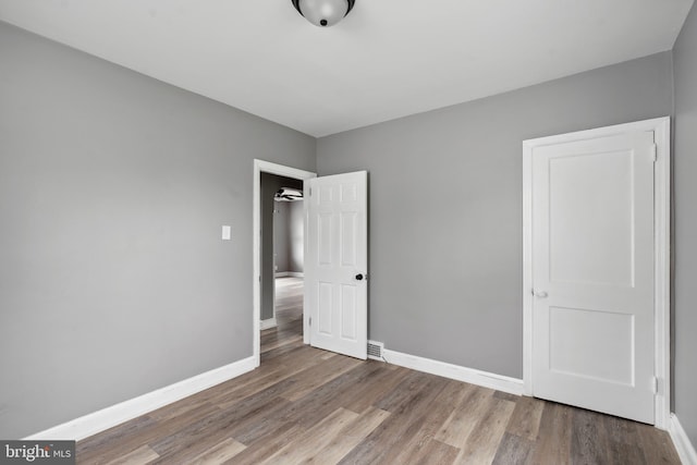 218 Center Ave, Mount Ephraim, NJ 08059 - unfurnished bedroom featuring wood finished floors and baseboards