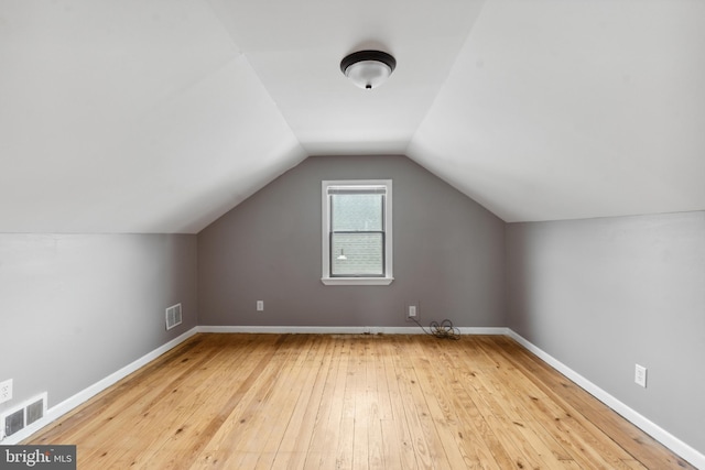 218 Center Ave, Mount Ephraim, NJ 08059 - additional living space with wood-type flooring, vaulted ceiling, and baseboards