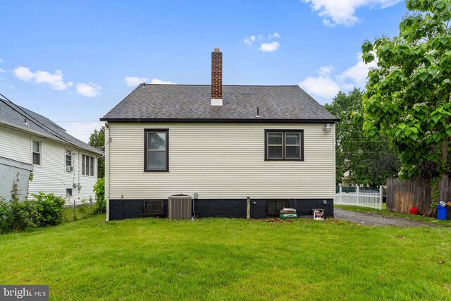 218 Center Ave, Mount Ephraim, NJ 08059 - back of house with a chimney, central AC, and a shingled roof