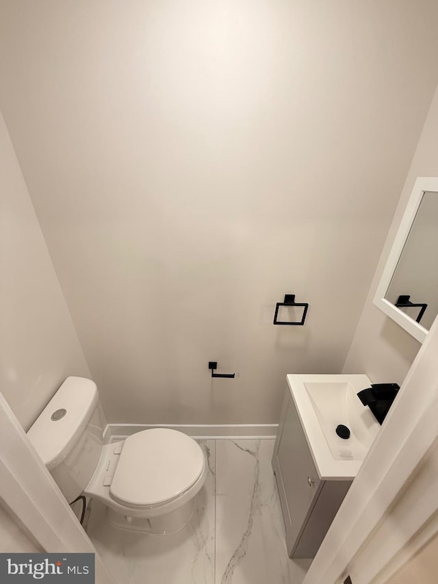 114 Marshall Rd, Lansdowne, PA 19050 - half bath featuring marble finish flooring, toilet, vanity, and baseboards